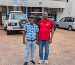 Full length picture of two dark skinned men smiling
