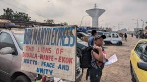 A sign on a street in Cameroon which reads peace and unity