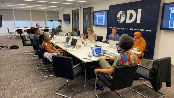 A group of researchers sat around a table