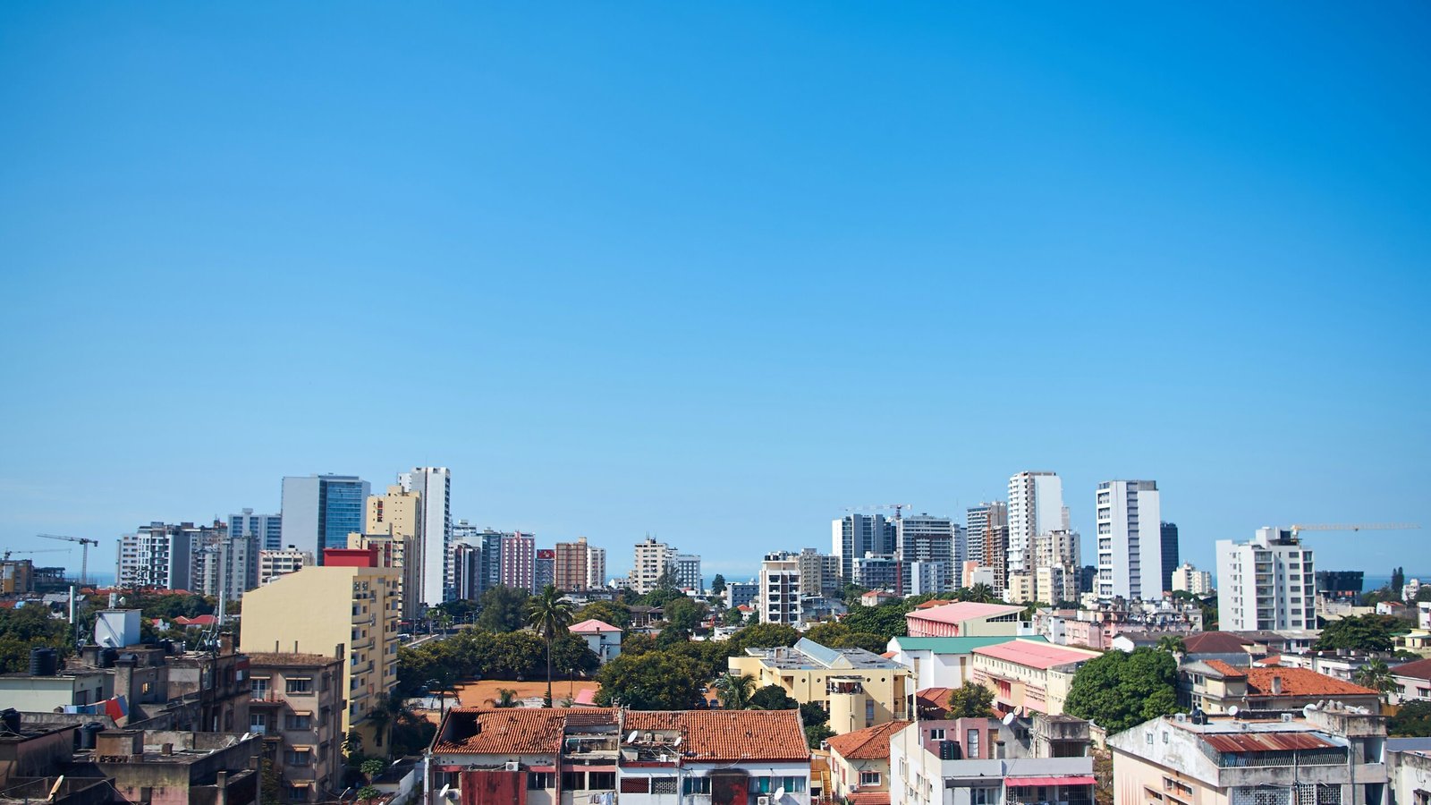 View of Maputo city with tall buildings against cloudless blue sky